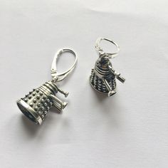 "EXTERMINATE Handmade silver Dalek Earrings - inspired by the one and only Doctor Who. This is 925 sterling silver, 100% free from Nickel (Ni) so if you are nickel allergic you will not react to this. The surface is treated with oxide for a \"greyish\" look. These are quite heavy earrings and should be worn with a little care so you don't hurt your ears. :) NOTE!! The style of the attachments can vary! Please let me know if you have any preferations. Weight: ~6 g Height: ~18 mm Width: ~11-12 mm Silver Themed Earrings As A Gift, Nickel-free Silver Themed Jewelry, Themed Sterling Silver Jewelry In Silver, Handmade Themed Sterling Silver Jewelry, Obi Wan Lightsaber, Doctor Who Jewelry, Heavy Earrings, Wibbly Wobbly Timey Wimey Stuff, Timey Wimey Stuff