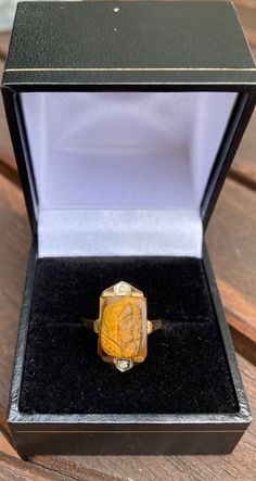 "Pacific Jewelry Key West Presents, ✔ Gemstone: Carved Tiger's Eye Intaglio ✔ Gold Kt: 14K ✔ Available Gold Color: Yellow Gold ✔ Rose Cut Diamond: 2 pcs 0.5 MM (0.14ctw) ✔ Gem Measurements: 14 x 10 mm, Rectangle ✔ Ring Size: 6 SHIPPING TIMES USA: 3-14 business days (USPS/Fedex) Canada: 5-14 business days Australia: 5-12 business days (Australia Line) New Zealand: 7-20 business days Europe: 5-14 business days Other countries: 10-25 business days ---------- LAYAWAY PLAN AVAILABLE---------- Our lay Roman Soldier, Rectangle Ring, Square Earrings Studs, Square Stud, Cross Ring, Emerald Earrings, Square Earrings, Tigers Eye, Eye Art