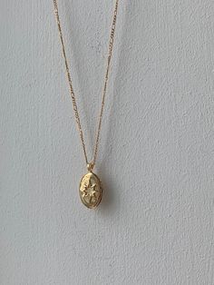 Our new gold locket necklace hangs on a long chain making it the perfect piece for summer necklace layering. Gold Locket Necklace Aesthetic, Dainty Gold Plated Pendant Locket Necklace, Yellow Gold Necklace With Large Oval Pendant, Vintage Oval Necklace With Adjustable Chain, Gold Necklaces With Large Pendant For Everyday, Rose Gold Necklace With Large Pendant, Everyday Tarnish Resistant Flower Pendant Necklace, Everyday Yellow Gold Necklace With Large Pendant, Everyday Tarnish-resistant Flower Pendant Necklace