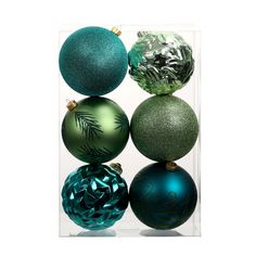 four christmas ornaments in a clear box on a white background, with one green ornament and the other blue