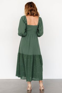 Beautiful dress for any occasion Lightweight woven crepe material Soft Green color Florentine neckline Smocked bodice Long puffed sleeve Shirred cuff with delicate ruffle Natural waistline Flowy skirt with single eyelet lace tier Hidden side pockets Fully lined bodice Skirt lined to tier Self: 100% Cotton, Contrast: 100% Cotton, Lining 100% Polyester Marianne is 5'6, cup size 34D, size 6 and wearing size S Florentine Neckline, Soft Green Color, Crepe Material, Maxi Dress Green, Long Puff Sleeves, Eyelet Lace, Flowy Skirt, Cup Size, Beautiful Dress