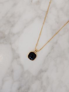 A symbol of strength and clarity, the black onyx in the "Nocturne" Square Necklace carries with it a quiet power. Known for its grounding properties, this natural stone offers protection and emotional resilience, while the 18k Gold Vermeil over sterling silver enhances its allure with a soft, golden glow. In its geometric simplicity, the square charm represents balance and stability, a perfect harmony between elegance and meaning. Materials: Natural black onyx, framed in 18k Gold Vermeil over st Gold Spiritual Obsidian Jewelry, Elegant Obsidian Jewelry For Healing, Black Natural Stones Jewelry For Meditation, Spiritual Black Onyx Necklaces, Spiritual Black Onyx Necklace, Black Spinel Gemstone Necklace For Gift, Black Onyx Jewelry For Meditation, Black Spinel Gemstone Necklace, Black Spinel Jewelry With Polished Finish