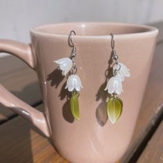 More on our lily of the valley earrings section:  https://www.etsy.com/shop/floralfenzy?ref=shop_sugg_market&section_id=42804670 🌸 Looking for a unique and elegant pair of earrings? Look no further than our Lily of the Valley style beaded earrings!  🌸 These earrings feature delicate and detailed beaded lily of the valley flowers with a green leaf decoration in the back, making them the perfect accessory for any outfit.  🌸 They're also incredibly lightweight and easy to wear, so you can keep them on all day long.  ✈️ Handling & Shipping usually takes about 10 days in total, so please consider the processing time if it's a time sensitive gift. 🌹 We are trying our best to package your orders with love and care ❤️ Hope you understand our processing time! ⚠️ Returns & Exchanges: We accept r Beaded Lily Of The Valley, Lily Of The Valley Earring, Lilly Of The Valley Jewellery, Lily Of The Valley Jewelry Ring, Lily Of The Valley Items, Christmas Gift For Best Friend, Leaf Decoration, Lily Of The Valley Flowers, Valley Flowers