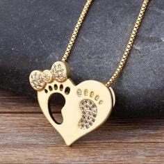 Material 14k Gold Plated & Simulated Diamonds. Heart Bow Baby Feet Necklace Weight 10g Feet Necklace, Baby Necklace, Baby Bows, Gold Heart, Heart Of Gold, Locket, Womens Jewelry Necklace, Gold Plate