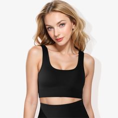 The Anna-Kaci Women's Scoop Neck Cropped Rib Knit Seamless Sports Bra is a stylish and versatile addition to your activewear collection. This sports bra features a scoop neckline and a cropped design for a contemporary look. The rib knit fabric ensures a comfortable, stretchy fit that moves with you. Its seamless construction provides a smooth, irritation-free experience during workouts. The scoop back and strap detailing add a unique and supportive touch, while the banded bottom offers extra st Black Fitted Seamless Fabric Crop Top, Black Stretch Sports Bra With Seamless Construction, Black Sports Bra With Seamless Stretch Construction, Solid Seamless Sports Bra For Gym, Black Seamless Crop Top With Medium Support, Black Crop Top With Seamless Design And Medium Support, Black Seamless Medium Support Crop Top, Black Stretch Seamless Crop Top, Black Seamless Stretch Sports Bra