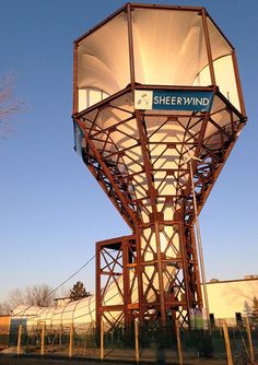 a tall metal tower with a sign on it