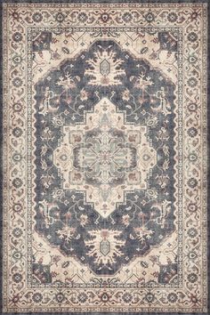 a blue and beige rug with an ornate design