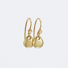 Classy and fine 14k gold dangle earrings, small yet eye catching. They are handmade of yellow 14k solid gold, and have a highly shiny finish. The smooth minimalist gold teardrops dangle and shine with every slight movement. These modern and feminine gold earrings are great to wear day or night, casual or dressy.  A wonderful gift for someone you love, and a treat for yourself. Total length of the earrings is 21 mm = approx. 0.8 inch Drop's height is 9 mm = approx. 0.35 inch Drop's width is 7.7 mm = approx. 0.30 inch Silicone ear backs are included for safety. * The earrings will be packed in a gift box ready to give as a gift, and shipped via Express mail service which usually takes 4-6 business days to arrive. * For more gold earrings click here: http://www.etsy.com/shop/SigalGerson?secti Yellow Gold Briolette Single Earring, Single Briolette Earring In Yellow Gold, Yellow Gold Dangle Teardrop Earrings For Everyday, Everyday Yellow Gold Dangle Teardrop Earrings, Gold Hypoallergenic Teardrop Earrings In Sterling Silver, Modern Yellow Gold Briolette Earrings, Hypoallergenic Gold Teardrop Earrings In Sterling Silver, Classic Gold Teardrop Earrings In Sterling Silver, Modern Gold Teardrop Earrings In 14k Gold