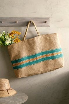 Made from hand-loomed jute and topped with colorful stripes, this roomy tote is a practical companion for the market, beach, or daily errands. | Baja Jute Shopping Tote Bag at Terrain Handwoven Striped Beach Bags, Striped Straw Tote Bag For Everyday Use, Handwoven Striped Bags For Everyday Use, Everyday Handwoven Striped Bags, Green Jute Tote Beach Bag, Striped Woven Bags For Shopping, Woven Striped Shopping Bags, Striped Woven Shopping Bags, Anthropologie Bag