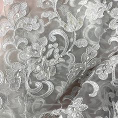 Look no further than Lace USA for the perfect beaded and corded bridal fabric lace for your special event. Our handcrafted, high quality lace material is inlaid with intricate pearls, sequins and beads and is embroidered on 100% polyester net mesh. It's perfect for a wedding dress, evening gown, dance costume or quinceanera dress, and the fabric comes in 5 different color options. Our beaded and corded bridal fabric lace is the best choice for adding a touch of opulence to your special occasion. Elegant Wedding Lace Fabric And Notions, Elegant Wedding Fabric With Lace Work, Elegant Wedding Fabric With Intricate Embroidery, Elegant Wedding Fabrics With Intricate Embroidery, Wedding Lace Fabric With Intricate Embroidery, Embroidered Lace Wedding Dress For Mother Of The Bride, Intricate Lace Embroidery Fabric For Brides, Silver Lace Embroidered Fabric For Wedding, Quinceanera Crown