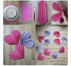 some pink and purple paper fans are on the floor next to a white tea cup