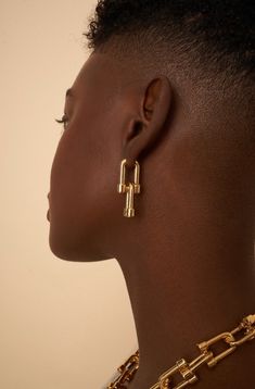 Zoë Earrings - Versatile and Statement-Making Transform your look with the Zoë Earrings from Oma The Label, crafted to deliver a bold yet understated flair. These adjustable U-link drop earrings let you customize the length to perfectly complement your outfit or mood, offering versatility and elegance in one chic design. Ideal for both special occasions and everyday wear, the Zoë Earrings make a striking statement with their unique, adaptable design.Part of our STMNT Collection, the Zoë Earrings Choker Designs, Bodysuit Tops, Cylinder Shape, Chic Design, Piercing Jewelry, The Label, Silver Fashion, Ear Cuff, Gold Earrings