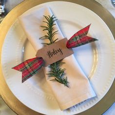 a white plate topped with two folded napkins