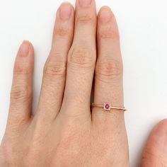 This CERTIFIED Ruby Ring features Genuine Ruby at 2mm (0.03 Carats) set in Solid 14k Rose Gold Ring setting. Designed to stand-alone or stack with the rest of our Stackable Ring collection, this ring would make the perfect July Birthday gift.Solid 14k Yellow Gold ☞ made to last.Click here for ☞ Solid Gold Collection﻿Ruby Details:• CERTIFIED Natural Ruby• Weight: 0.03 Carats• Dimensions: 2mm• Cut: Diamond CutSetting Details:• 2.2 grams of 14k Solid Rose Gold• Dimensions: Band width ≈ 1.3mm, thick Dainty 14k Rose Gold Solitaire Jewelry, 14k Rose Gold Stackable Rings With Single Diamond, Rose Gold 14k Gold Stackable Rings With Single Diamond, Fine Jewelry Rose Gold Midi Ring With Diamond, Minimalist 14k Rose Gold Solitaire Jewelry, Delicate Stackable 14k Rose Gold Rings, Fine Jewelry Rose Gold Birthstone Ring With Single Diamond, Dainty Solitaire Rose Gold Stackable Rings, Rose Gold Stackable Rings With Single Diamond