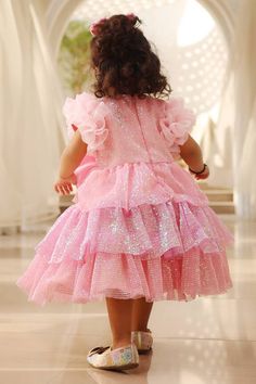 Pink tiered sequined frock with frilled sleeves and a big bow in the center. - Aza Fashions Pink Ruffle Dress For Dress-up, Pink Ruffle Dress For Dress-up Occasions, Pink Tiered Ruffle Dress For Party, Princess Style Party Frock With Ruffles, Princess Style Frock With Ruffles For Parties, Pink Princess Style Ruffle Dress For Party, Pink Princess Ruffle Dress For Parties, Tiered Ruffle Dress For Dress-up, Pink Princess Style Party Ruffle Dress