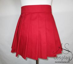 "Ruby Red / Dark Rich Red Pleated Mini Skirt-   Pair with Orange Turtleneck/Orange Socks for a fun, quick Halloween Costume or Cosplay This pleat skirt in rich red, a dark ruby color, is available in mini lengths from 12 inches to 16 inches.  The skirt is 100% cotton and made from top quality materials.   It is machine washable and dryer safe though we do recommend using cold water and air drying the skirt or pull out of the dryer while still damp and hang to keep the pleats crisp.   Iron as needed using cotton settings.  It is safe to use steam and high heat.  Washing in cold water keeps the color bright though color fading should be minimal even in hot water.  This skirt is durable and meant for everyday use. ORDERING INSTRUCTIONS: Please include your waist measurement in the \"notes to Orange Knee High Socks, Velma Halloween Costume, Velma Costume, Orange Turtleneck, Velma Cosplay, Quick Halloween Costumes, Red Pleated Skirt, Skirt With Pleats, Ruby Color