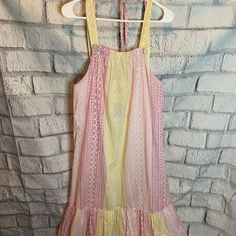 Pink And Yellow Tiered Skirt Midi Dress Sleeveless Tie At Back Size L Cotton Measurements: Length 46”, Armpit To Armpit 22” Yellow Sleeveless Ruffled Midi Dress, Yellow Sleeveless Midi Dress With Ruffles, Yellow Maxi Sundress With Ruffles, Yellow Ruffled Maxi Sundress, Yellow Sleeveless Dresses For Brunch, Yellow Ruffled Midi Dress For Casual Wear, Yellow Midi Dress With Ruffles For Casual Wear, Yellow Midi Dress With Ruffles For Casual Occasions, Yellow Midi Dress With Spaghetti Straps For Spring