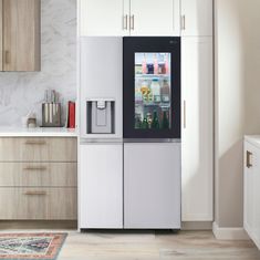 a refrigerator freezer sitting inside of a kitchen