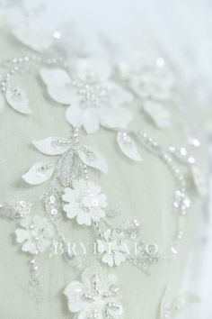 With silver embroidered brunches and laser cut flowers and leaves on soft tulle base, this lace fabric is perfect for making romantic wedding dresses and illusion bridal boleros. The clear sequins and silver beading bring your designs shimmery and luxury look. shown color light ivory sold by the yard content nylon, polyester, PET weight medium/heavyweight width 130cm washing instructions hand wash/drip dry Laser Cut Flowers, Flower Lace Fabric, Romantic Dresses, Romantic Wedding Dresses, Bridal Bolero, Fabric Accessories, Soft Tulle, Flower Lace, Romantic Dress