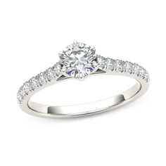 Simply designed with spectacular results, this diamond engagement ring is sure to create a stir. Crafted in cool 14K white gold, this streamlined style features a 1/2 ct. diamond center stone in a six-prong setting atop a cathedral-look shank that sparkles with diamonds. Captivating with 3/4 ct. t.w. of diamonds and a bright polished shine, this engagement ring is certain to dazzle and delight. Classic White Diamond Ring With Tension Setting, White Diamond Ring With Center Stone In Classic Cut, White Diamond Ring With Classic Cut Center Stone, White Diamond Promise Ring With Classic Cut, White Diamond Promise Ring Classic Cut, Classic Cut White Diamond Promise Ring, White Platinum Diamond Ring With Tension Setting, Types Of Gems, Peoples Jewellers