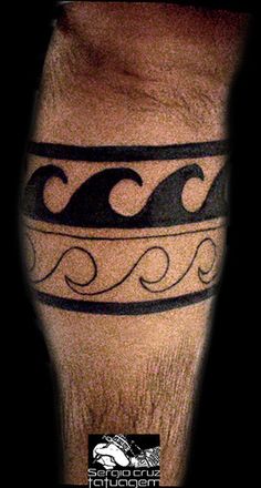 a man's leg with a black and white tattoo design on the side of his leg