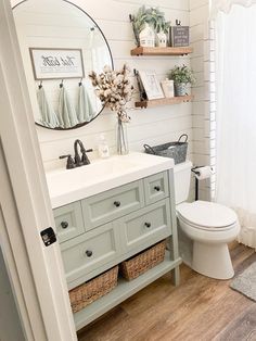 the bathroom is decorated in white and gray