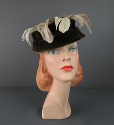 Vintage Brown Velvet Feather Hat, 1950s Evening  ERA: True vintage hat from the 1950s MEASUREMENTS: The hat will fit a 21-22  inch head, will need a pin to secure MATERIAL: velvet and feathers LABEL: none Dark brown velvet hat with shallow crown and short brim that is downward in the front and narrows in the back. Ivory and light brown feathers around the top of the hat with a spiral brown feather in the center.  CONDITION: The hat is in very good condition. The lining inside is loose. Velvet Hat, Feather Hat, Brown Fur, Brown Velvet, Red Felt, Vintage Hat, Evening Cocktail, Felt Hat, Vintage Brown