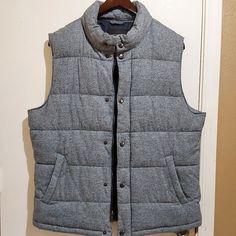 Tags Were Removed, But This Insulated Puffer Vest Has Never Been Worn & Is In Perfect New Condition! Full Zipper & Snap Front. 2 Pocket Front & Additional Inside Pocket (Like A Sport Coat Pocket). Gray With Black Lining & Detailing. Size L. Laid Flat, Chest Measures 24" Across. Length Is 27". Please Feel Free To Ask Questions. Grey Puffer Vest Men, Casual Wool Vest, Casual Fitted Winter Vest, Fitted Casual Vest For Cold Weather, Casual Wool Vest For Winter, Mens Banana Republic, Coat Pocket, Flat Chest, Puffer Vest