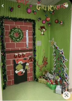 a room decorated for christmas with green walls and decorations on the wall, including a red brick fireplace