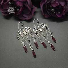 These Bat Chandelier Earrings have the perfect vampire vibes and showcase a victorian, gothic style. Enhance your nocturnal look and pair with our Choker, Necklaces, Rings, and Bracelets. Details: Fashion Jewelry ~ Handmade Total Length: 92mm Black Crystals: 4mm Dark Red Glass Daggers: 15.5x5mm Bat Charm: 22x32mm Gothic Handmade Jewelry, Diy Goth Jewelry, Bat Chandelier, Vampire Accessories, Vampire Vibes, Gothic Jewelry Diy, Vampire Earrings, Vampire Jewelry, Vampire Fashion