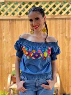 This Beautiful Off the Shoulder Crop Top is the perfect Top for a fun day out or special event. It is comfortable, has elastic around the shoulders, sleeves and waist. This blouse is completely hand embroidered by Mexican Artisans in Guanajuato, Mexico making it one of a kind! More colors available here: https://www.etsy.com/es/listing/936613756/blusa-crop-top-floral-blusa?ref=listings_manager_grid Shop the Artisanal earrings modeled here: https://www.etsy.com/es/listing/918692155/aretes-mexican Bohemian Denim Top For Spring, Summer Embroidered Denim Top, Bohemian Embroidered Denim Tops, Spring Festival Denim Top, Bohemian Top With Multicolor Embroidery For Festivals, Bohemian Tops With Multicolor Embroidery For Festival, Bohemian Festival Tops With Multicolor Embroidery, Bohemian Tops With Floral Embroidery For Festivals, Bohemian Embroidered Top For Fiesta In Spring