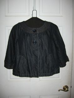 This is a very nice Ann Taylor dark denim jacket with 3/4 length sleeves. I did have to replace the buttons on this jacket due to one being lost. Laying flat the jacket measures 20" from armpit to armpit and is 20" long from the top of the collar. The sleeve measures 18" from the bottom of the collar to the end of the sleeve. The material is 60% cotton and 40% linen. Thanks for looking. Casual Outerwear With 3/4 Sleeve And Buttons, Casual Outerwear With Buttons And 3/4 Sleeves, Casual Cotton Outerwear With 3/4 Sleeves, Cotton Outerwear With 3/4 Sleeve For Fall, Fall Cotton Outerwear With 3/4 Sleeve, Dark Denim Jacket, Dark Denim Jeans, Blazer With Jeans, To The End