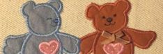 two teddy bears sitting next to each other with hearts on their chest and one bear holding the other's hand