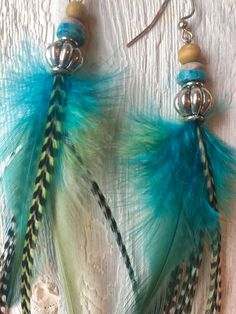 "These beautiful earrings are 7\"in length and will compliment any hair color.   Show off your confident style with these natural rooster feathers hand picked for a display of texture and color!" Green Bohemian Feather Earrings, Green Bohemian Earrings With Feathers, Bohemian Green Feather Earrings, Adjustable Blue Feather Earrings, Blue Feather Dangle Earrings, Blue Feather Earrings For Gift, Blue Feather Earrings As Gift, Blue Feather Earrings Gift, Feather Extensions