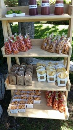 an outdoor food stand with various foods on it