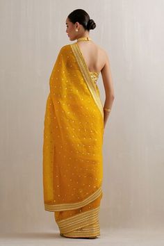 Mango yellow saree with aari, sequin, zari embroidery. Paired with halter neck embroidered blouse and petticoat. - Aza Fashions Yellow Resham Embroidered Pre-draped Saree For Festivals, Yellow Pre-draped Saree With Gota Work For Party, Yellow Pre-draped Saree With Resham Embroidery For Festive, Yellow Pre-draped Saree With Resham Embroidery For Festive Occasions, Festive Yellow Pre-draped Saree With Resham Embroidery, Fitted Yellow Pre-draped Saree With Mirror Work, Yellow Fitted Pre-draped Saree For Festive Occasions, Festive Yellow Fitted Pre-draped Saree, Yellow Mirror Work Pre-draped Saree For Navratri