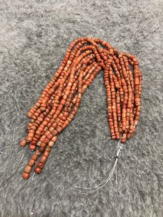 10 Strands Of Old Coral Beads From Morocco The Color is an Orange Red The little black spots in this coral are an indication of age Dimensions : the smallest bead is 3.9mm x 3.8mm the largest bead is 7mm x 6,7mm Length of Strand : 26cm Weight : 117g Bohemian Polished Red Coral Beads, Bohemian Red Coral Polished Beads, Traditional Coral Gemstone Beads, Traditional Coral Beaded Necklaces, Red Coral Polished Beads For Jewelry Making, Handmade Red Coral Round Beads, Handmade Red Coral Beads, Handmade Round Red Coral Beads, Orange Bohemian Red Coral Beads