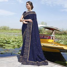 Navy Blue colored embroidered saree is made from Bluecherry Silk fabric which is highlighted with beautiful embroidered work.Comes along unstitched Crepe Silk blouse piece which you can customise as per your design/style.Occasion - You can wear this saree for party, special occasions, ideal for any fasionista. Style it up - Look glamorous in this traditional saree by (SUBHASH SAREES) Pair this saree with Ethnic Gold Jewellery, beautiful clutch to complete the look!! Reception Saree With Embroidered Border In Chinon, Chinon Saree With Embroidered Border For Reception, Reception Saree With Embroidered Border, Elegant Blue Embroidered Dola Silk Fabric, Embroidered Blue Pre-draped Saree For Diwali, Designer Blue Embroidered Saree Fabric, Designer Embroidered Blue Saree Fabric, Blue Embroidered Saree For Designer Wear, Blue Embroidered Saree Fabric For Designer Wear