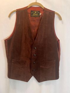 This vintage leather western vest is made in the USA. It's in great condition but does have a seam separating on pocket- see pic. size: medium  Measures: 20" pit to pit                         24" long Cowboy Vest, Western Vest, Leather Waistcoat, Cowboy Aesthetic, Brown Vest, Cowboy Outfits, Mens Vests, Wilmington Nc, Vest Outfits