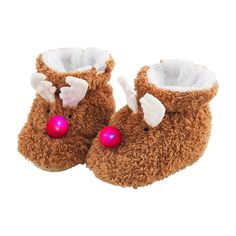 a pair of brown slippers with white and pink decorations