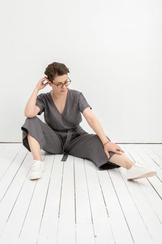 Linen Wrap Jumpsuit, Grey Jumpsuit, Linen Loungewear D E S C R I P T I O N - Wrap-style jumpsuit for a comfortable fit - Elegant V-shaped neckline - Kimono sleeves (short) - Attached tie at waist, gentle pleats at the waist - Deep side pockets - A wide, culottes-style leg (rather than a tapered one) D E T A I L S - Name: LONDON - Sizes: XS - XXL - Color: Mustard, Dusty peach, Salmon, Terracotta, Burgundy red, Cacao, Pine green, Chartreuse green, Milky white, Dusty Lavender, Light Grey, Mint, Sky Gray Fitted V-neck Jumpsuits And Rompers, How To Style Culottes, Linen Overall, Jumpsuit Linen, Jumpsuit Wide Leg, Grey Jumpsuit, Boho Jumpsuit, Wrap Jumpsuit, Linen Loungewear