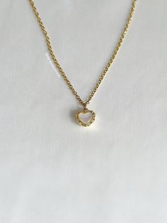 A timeless, vintage style necklace featuring a pearl shell heart charm on a 2mm rolo chain, resistant to tarnishing. An absolute essential in every jewelry collection. Our chains are 100% stainless steel and hypoallergenic so they won't rust, tarnish, or turn your neck green. - Stainless steel chain - Lobster clasp closure - 14kt gold filled pendant - Select desired size at checkout Dainty Round Heart Necklace Tarnish Resistant, Gold Dainty Heart Necklace With Pearl Charm, Dainty Gold Heart Necklace With Pearl Pendant, Dainty Heart Necklace With Pearl Pendant For Anniversary, Dainty Heart Necklace With Pearl Charm For Anniversary, Dainty Heart Necklace With Pearl Pendant As Gift, Delicate Heart Necklace With Pearl Charm, Dainty Heart Necklace With Pearl Charm For Wedding, Dainty Heart Necklace With Pearl Charm For Valentine's Day