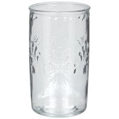 a clear glass vase sitting on top of a white table