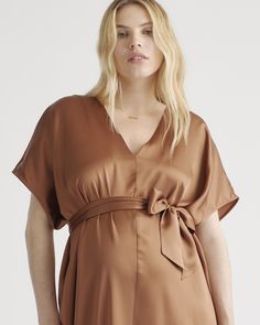 An elevated upgrade to basic maternity wear. This easy-to-wear silhouette is perfect for a date night or destination wedding. With a removable belt, there are multiple ways to wear it. This super flattering fit is made from 100% mulberry silk, in a satin finish. The best part…our silk is washable. Easy to style and easy to wash for low-maintenance luxe. Plus, silk fiber contains 18 kinds of amino acids that make it amazing for skin nourishment, hypo-allergenic, and naturally thermoregulating to Elegant V-neck Bump Friendly Dresses, Elegant V-neck Bump-friendly Dress, Elegant V-neck Maternity Dress For Brunch, Elegant Short Sleeve Maternity Dress For Brunch, Brown Maternity Wear Dresses, Silk Maternity Dress, Maternity Overalls, 7 Months Pregnant, Silk Fiber