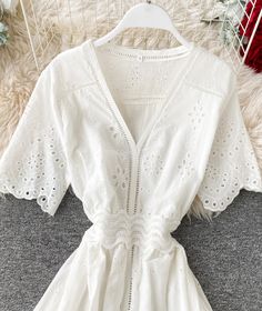 White v neck short sleeve dress fashion dress Fabric: lace Color: white Size(cm): S, M, L, XL S length 114 bust 84 waist 64 M length 115 bust 88 waist 68 L length 116 bust 92 waist 72 XL length 117 bust 96 waist 76 Feminine White V-neck Beach Dress, White V-neck Solid Mini Dress, Feminine White V-neck Dress For Spring, Chic Mini Dress With Lace Trim And Short Sleeves, Elegant Short Sleeve V-neck Dress For Vacation, V-neck Short Sleeve Dress For Beach In Spring, Feminine Short Sleeve Solid Color Mini Dress, Feminine White V-neck Summer Dress, Elegant V-neck Hollow Out Dress