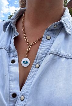 A colourful lariat style necklace featuring a round evil eye disc pendant in a choice of colours. Comprising an antique gold plated, lightweight curb chain, this bohemian pendant necklace adds a unique splash of colour to your outfit, whilst also providing a good vibes aesthetic. Perfect for casual summer styling.  ▪️Gold plated stainless steel curb chain ▪️Chain length 18 inches ▪️Enamel disc pendant  ▪️Choose your pendant colour ▪️The necklace will be presented in attractive Scraffs packaging White Chain Necklace For Festivals, White Chain Necklace For Festival, Gold Evil Eye Jewelry For Festivals, Gold Evil Eye Necklaces For Festivals, Gold Necklaces With Evil Eye For Festival, Gold Evil Eye Necklace For Festival, Bohemian Gold Chain Necklace Gift, Bohemian Gold Chain Necklace For Gift, Bohemian Gold Chain Necklace For Festivals