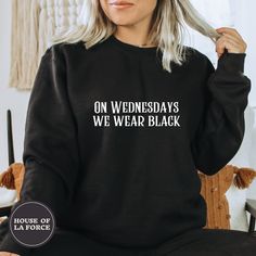 "\"On Wednesdays We Wear Black\" Adult Sweatshirt This soft sweatshirt has a loose fit for a comfortable feel. :: SIZING :: - This trim-blend sweatshirt fits true to size, if you are in between sizes, we recommend sizing up - Please check out our size chart for measurements to ensure an accurate fit - No exchanges/returns for wrong size orders :: WASHING INSTRUCTIONS :: - Turn garment inside out and wash cold. - Tumble dry on low temperature setting. - Do not iron directly on the print. ::GARMEN Edgy Black Halloween Sweatshirt, Black Punk Sweatshirt With Letter Print, Black Punk T-shirt For Winter, Black Cotton Punk Style Sweatshirt, Edgy Black Winter T-shirt, Edgy Black Cotton Sweatshirt, Trendy Black Halloween Sweatshirt, Black Punk Style Sweatshirt For Halloween, Black Punk Style Halloween Sweatshirt