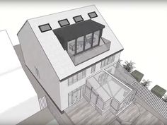 an aerial view of a two story house with a black awning on the roof