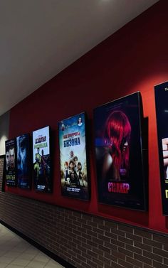 a row of movie posters on the wall