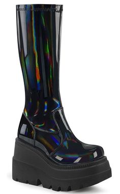 Shake it, baby! These tiered wedges are a cute variation on Demonia's other wedge collections. Vegan Black stretchy holographic leather 4 1/2 inch wedge Knee length Rear zip U.S women's sizing-refer to size chart for more info Holographic Boots, Hot Topic Shoes, Stretch Knee High Boots, High Platform Boots, Demonia Boots, Black Holographic, Knee High Platform Boots, Demonia Shoes, Wedge Heel Boots